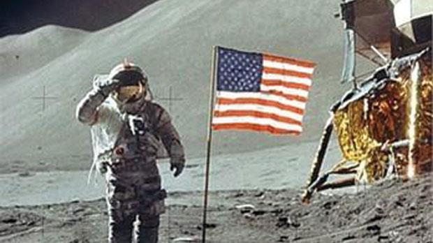 Neil Armstrong salutes the flag.